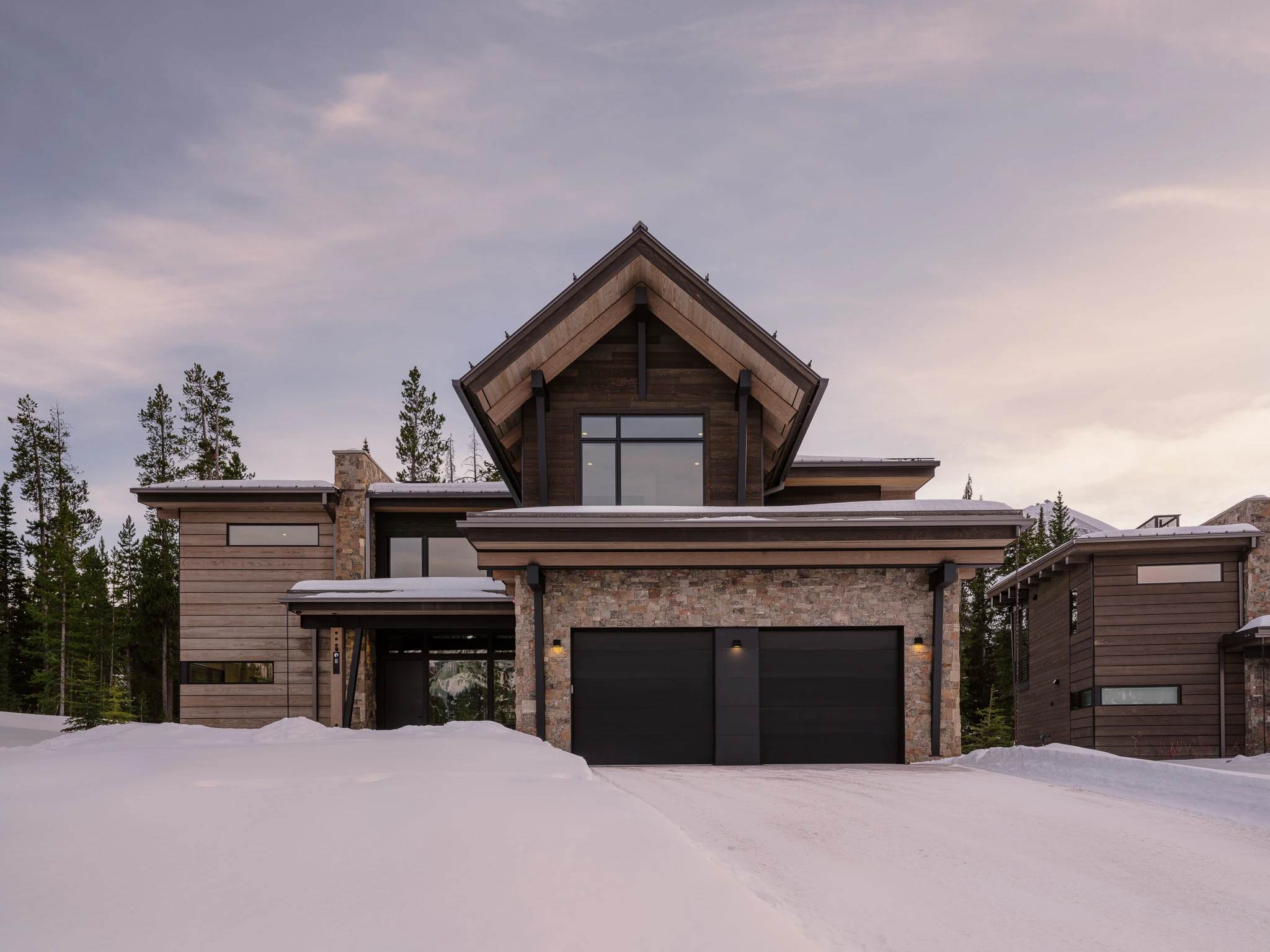 Exterior entry at dusk in the snow — architectural photography Big Sky Montana, Reid Smith Architects